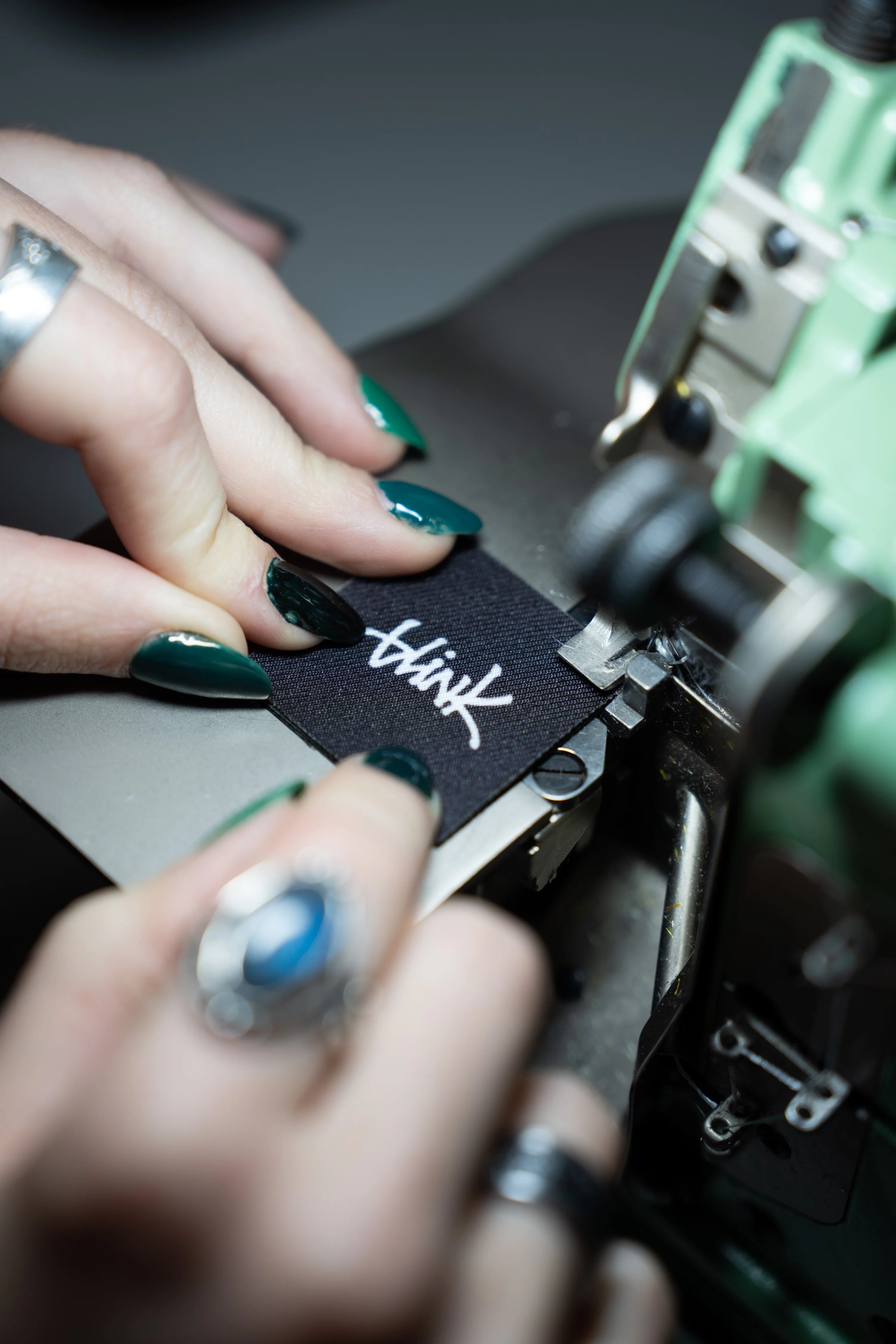 Embroidery machine running custom logo stitch