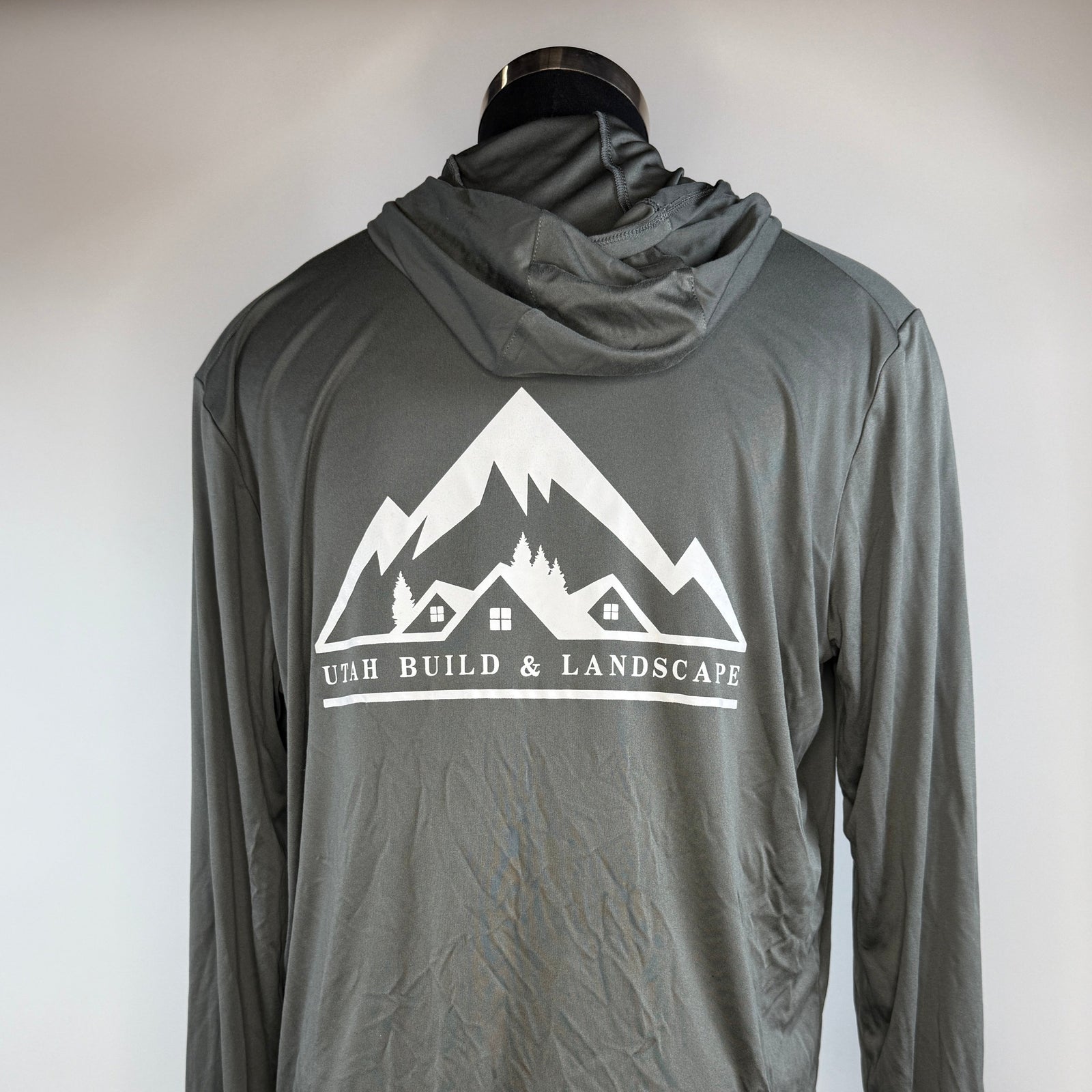 Gray hoodie with mountain logo and text on a white background